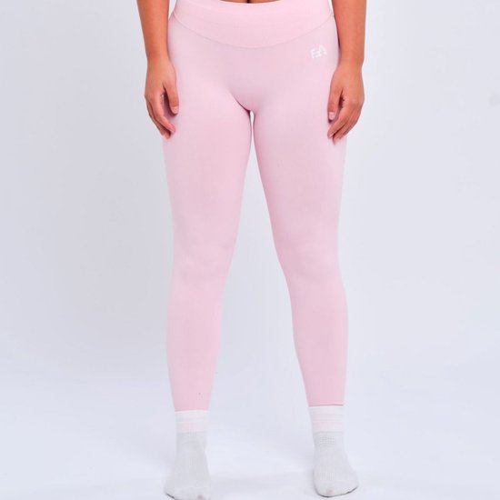 Roze sportlegging met V-band en logoprint op de heup. Gemaakt van nylon & spandex.