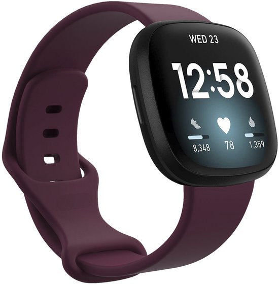 Bracelet en silicone rouge foncé autour d'une smartwatch avec écran.