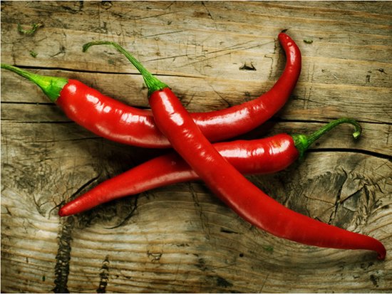 Fotobehang - Spicy chili peppers.