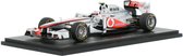 De 1:43 Diecast Modelauto van de McLaren Mercedes MP4/26 #4 van de Chinees GP 2011De coureur was Jenson Button.De fabrikant van het schaalmodel is Spark.