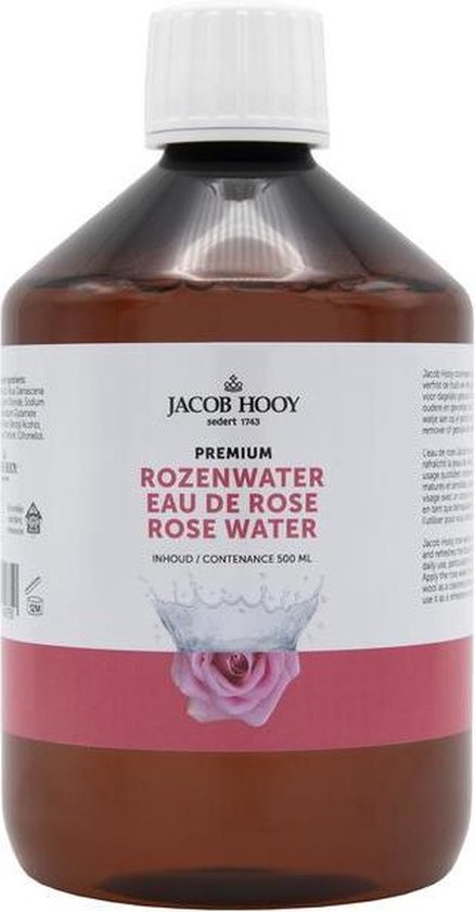 Jacob Hooy Rozenwater Premium. Bruine fles met wit opschroefdeksel, label met roze band en roze roos illustratie.