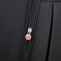 Ritssluiting met ronde 'Expandable' bedel op een zwarte koffer.