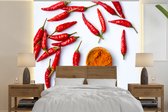 Behang - Fotobehang Verschillende cayennepepers of Capsicum frutescens met pollepel - Breedte 300 cm x hoogte 300 cm