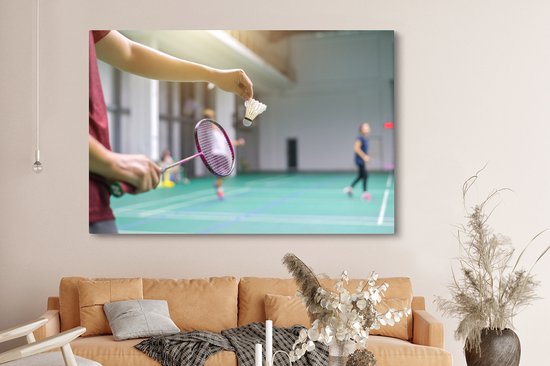 Canvas schilderij 150x100 cm - Wanddecoratie Een man staat op het punt om te badmintonnen - Muurdecoratie woonkamer - Slaapkamer decoratie - Kamer accessoires - Schilderijen op canvas