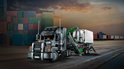 LEGO Technic Mack Anthem speelgoed vrachtwagen met aanhanger en container, op een achtergrond van scheepvaartcontainers.