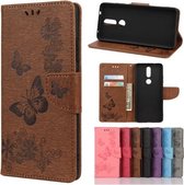 Voor Nokia 2.4 Vlinders Embossing Horizontale Flip lederen tas met houder & kaartsleuven & portemonnee (bruin)