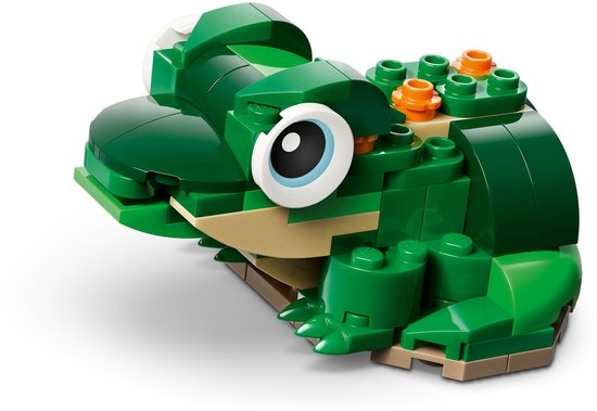 Groene LEGO-kikker met grote ogen, bruine buik en oranje stippen op de rug.