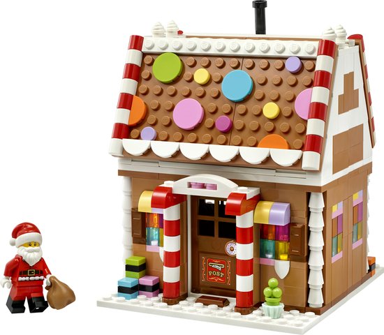 LEGO Kerst Peperkoekhuis 40809, voorkant, met kerstman met zak. Huis met witte, bruine en rode strepen en kleurrijke cirkels.