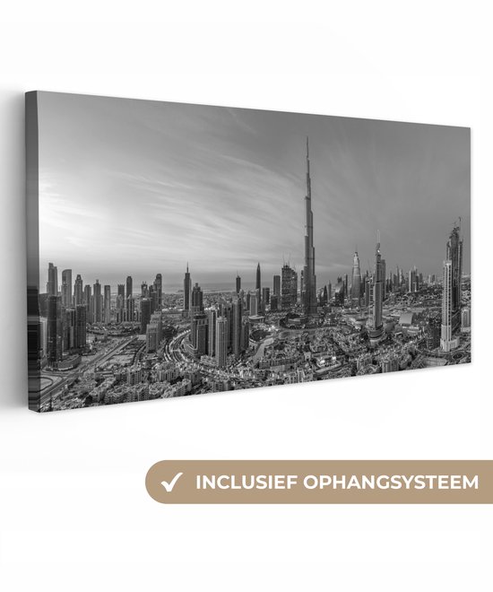 Panorama noir et blanc de la silhouette de Dubaï avec la Burj Khalifa, avec le texte 'Système de suspension inclus'.