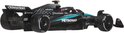 Zwarte F1-auto met turquoise lijnen, PETRONAS-logo en 'Crowdstrike'. Zijaanzicht.