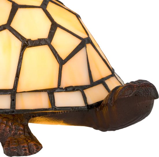 Glazen schildpadlamp met crème-witte panelen en een bruin, gedetailleerd onderstel.