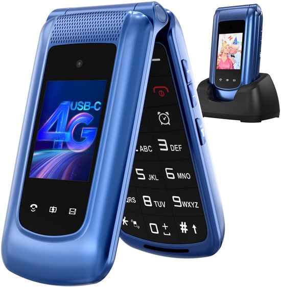 Blauwe klaptelefoon open met USB-C 4G op het scherm, naast een oplaadstation met telefoon erop.