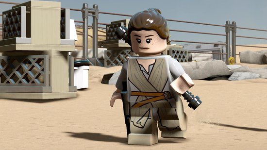 Lego Rey met bandjes en een lichtzwaard op een woestijnplaneet.