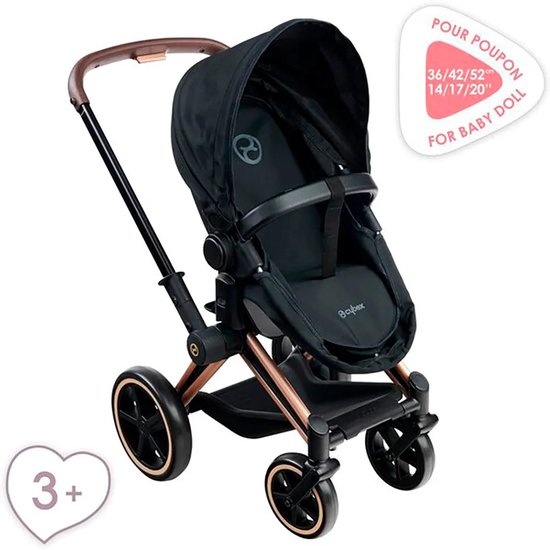 Zwarte poppenwagen met bruin handvat, koperkleurig frame en "3+" en "POUR POUPON" labels.