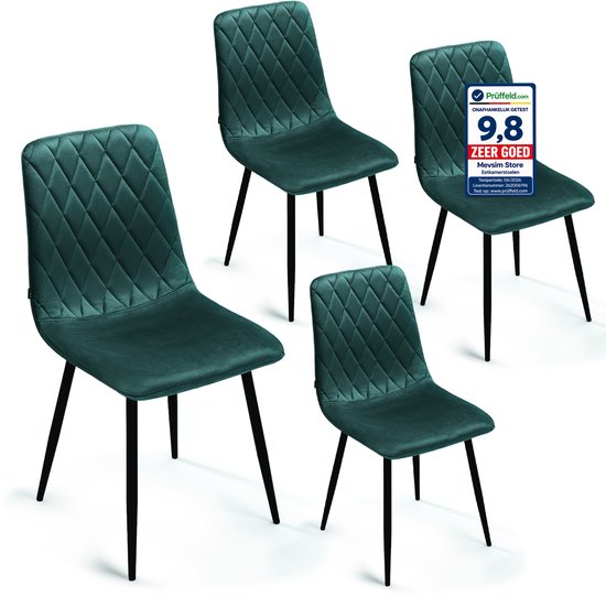 Set van vier groene fluwelen eetkamerstoelen met ruitpatroon en zwarte poten.