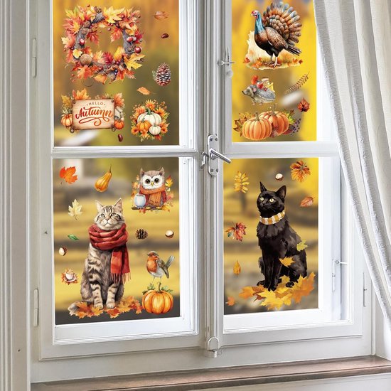 Herfst raamstickers op een raam, met katten, herten, uil, kalkoen en herfstbladeren.