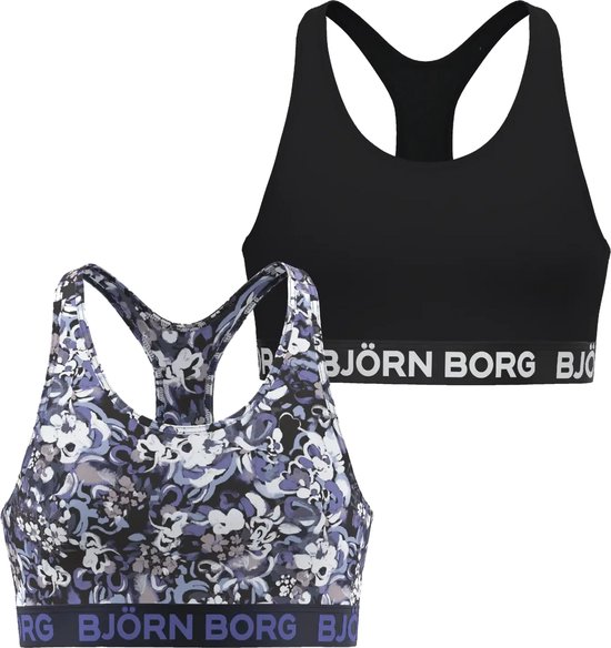 Zwarte sportbeha en paarse sportbeha met bloemenprint, beide met 'BJÖRN BORG' logo.