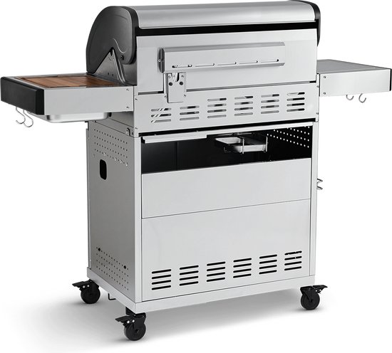 Zijkant van een roestvrijstalen gasbarbecue met uitklapbare tafel.