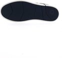 Zool van een donkerblauwe sneaker, wit met een donkerblauw profiel en 'G-STAR RAW' erop.
