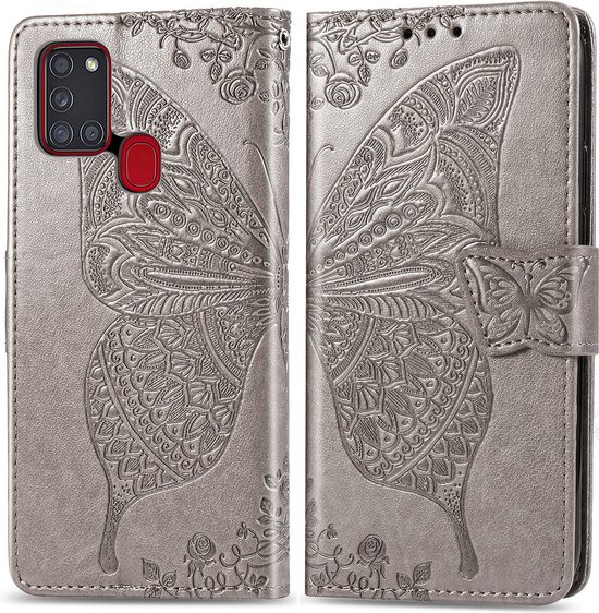 Coque de téléphone grise avec papillon détaillé et fleurs en relief, ouverte.