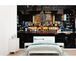 Behang - Fotobehang Een gezellige bar met verlichting op de flessen - Breedte 385 cm x hoogte 280 cm