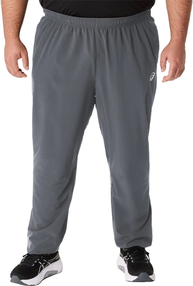 Asics core woven pant in de kleur grijs.