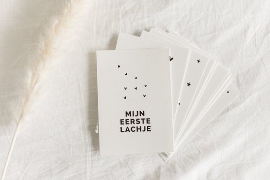 Baby mijlpaalkaarten met sterren en de tekst 'MIJN EERSTE LACHJE'.