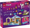 Boîte de la clinique vétérinaire LEGO Friends avec figurines, animaux, accessoires et instructions de montage.
