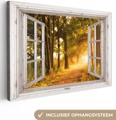 Canvas schilderij 90x60 cm - Wanddecoratie Bos - Bomen - Zonlicht - Herfst - Bospad - Natuur - Doorkijk - Muurdecoratie woonkamer - Slaapkamer decoratie - Kamer accessoires - Schilderijen