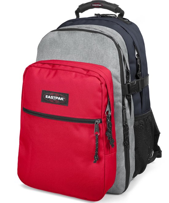 Sac à dos Eastpak avec poche avant rouge, compartiment principal gris et bleu marine.