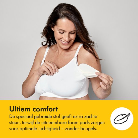 Une femme portant un soutien-gorge blanc avec des coussinets amovibles, avec le texte 'Confort ultime' et 'sans armatures'.