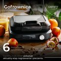 Zwarte wafelmaker met LED-display, fruitschaal, en tekst 'Gofrownica z wyświetlaczem LED'.