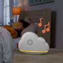 Witte muziekdoos in de vorm van een wolk met muzieknoten en een baby op de achtergrond.