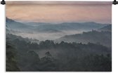 Wandkleed Mistig bos - Uitzicht over een mistig bos in India Wandkleed katoen 90x60 cm - Wandtapijt met foto