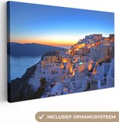 Canvas Schilderij Oia Santorini met kleurrijke zonsondergang in Griekenland - 60x40 cm - Wanddecoratie
