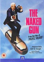 De man met de baard, in een pak en met een pistool, rijdt op een kogel. 'The Naked Gun'.