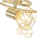 Close-up van een gouden plafondspot met een geometrisch armatuur.