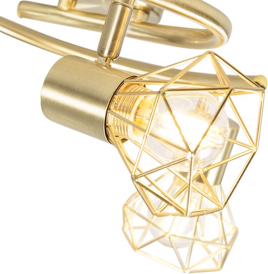 Close-up van een gouden plafondspot met een geometrisch armatuur.