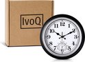 Zwarte wandklok met witte wijzerplaat en thermometer, 30 cm, naast kartonnen doos