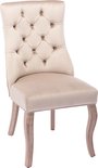 Beige fluwelen eetkamerstoel met knopquilting op de rug en zitting. Houten poten met gebogen vorm.